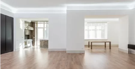 Open floor plan living space in a Michigan home with connected kitchen, dining, and living areas