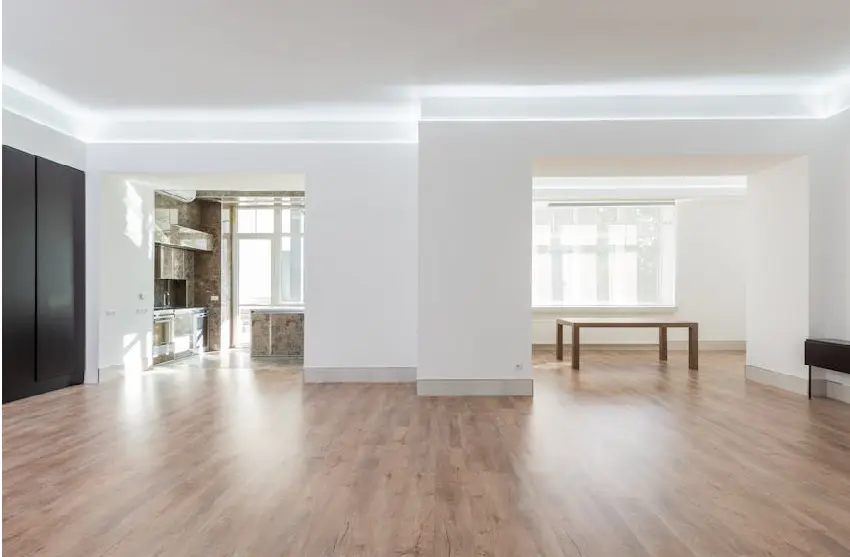 Open floor plan living space in a Michigan home with connected kitchen, dining, and living areas