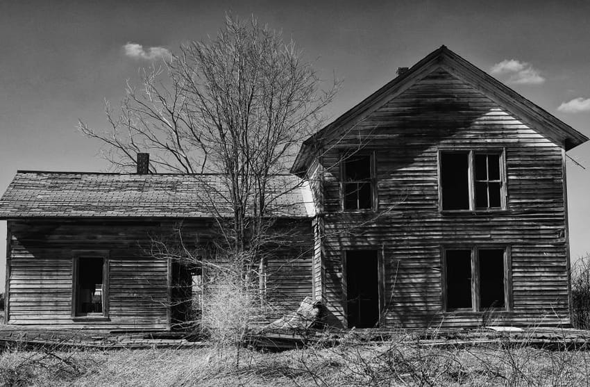 Fire-damaged house in Michigan showing severe structural damage before restoration and insurance assessment